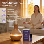 Sakally palo santo essential oil beside a wood-grain diffuser, with a woman meditating and text stating no added fragrance, carrier oils, synthetic fillers, or chemical solvents