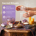 Hands above a smoking palo santo stick surrounded by crystals, candles, and a singing bowl, with text promoting ritual cleansing, focus, and relaxation